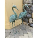 A PAIR OF GARDEN ORNAMENTS in the form of two heron birds / storks