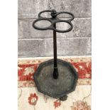 A 19TH CENTURY GOOD QUALITY CAST IRON UMBRELLA STAND, on claw feet, 70cm high approx