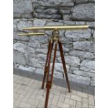 A TELESCOPE ON ADJUSTABLE STAND, max height 5ft (lower height 2ft) x 2ft 8 inches wide approx.