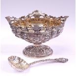 A VERY FINE LATE 19TH CENTURY SILVER BOWL WITH SPOON, gilt interior to both, decorated with scrollin
