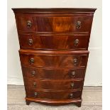 A VERY FINE MAHOGANY BOW FRONTED CHEST ON CHEST, with 2 over 4 graduated drawer arrangement, each wi