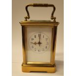 GOOD QUALITY FRENCH BRASS CARRIAGE CLOCK, with bevelled glass on all sides, with enamelled porcelain