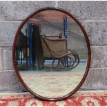 AN OVAL WALL MIRROR, 80 x 64cm approx.