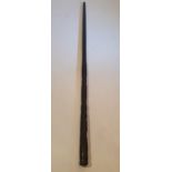 A RARE 19TH CENTURY IRISH BOG OAK WALKING CANE, decorated with carved design; including the Irish s