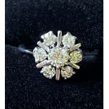 A VINTAGE 18CT WHITE GOLD DIAMOND DAISY CLUSTER RING, 1.10cts of diamond approx. Ring Size N.