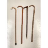 A COLLECTION OF WALKING STICKS to include one silver topped, largest 92cm high approx (4 pieces tota