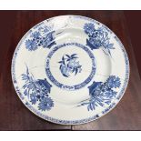 AN 18TH CENTURY CHINESE BLUE AND WHITE PLATE, with floral basket design, brown edging colour, with o