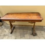 A VICTORIAN CAST IRON BASED TABLE, with mahogany top, 130 x 54 x 80cm (W x D x H) approx.