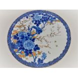A Chinese porcelain charger, with blue and white decoration of a sparrow on rose bud, with