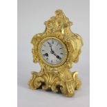 A 19th century French Rococo style gilt metal mantle clock, with eight day movement, the circular