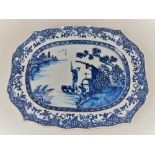 A Chinese blue and white porcelain platter, of oval scalloped form, decorated with a scene of a