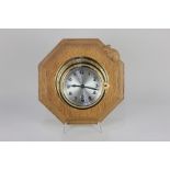 A Robert Mouseman Thompson wall clock bulkhesd style windup clock with silvered dial, on carved