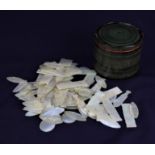 Approximately one hundred Chinese mother of pearl gaming tokens, various shapes and designs, in a
