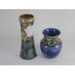 A Royal Doulton stoneware vase by Florrie Jones, flared cylindrical form with blue mottled glaze and