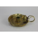 A Victorian brass chamberstick with detachable sconce and snuffer, base stamped S&S.B, 17cm