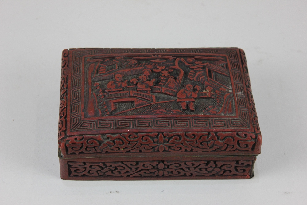 A Chinese cinnabar lacquered box, the lid decorated with figures in a landscape, 14.5cm (a/f)