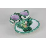 A Victorian majolica strawberry dish basket form moulded with strawberries and foliage, two pots for