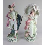 A pair of continental porcelain figures of a Lady and Gentleman both finely dressed, he wearing