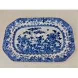 A small Chinese porcelain blue and white platter, decorated with a floral garden scene, 27cm wide