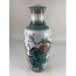 A large Chinese porcelain vase, the polychrome decoration of peacocks amongst chrysanthemums and
