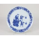 A Chinese blue and white porcelain side plate the centre decorated with a bearded elder carried by