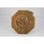 A Robert Mouseman Thompson Oak 1976 Centenary Octagonal Plaque, the centre carved with Robert