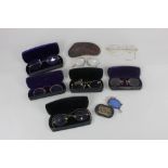 A collection of seven pairs of yellow metal framed pince nez and spectacles, to include six with