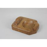 A Robert Mouseman Thompson oak ashtray, with carved signature mouse, 10cm