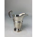 A George VI silver cream jug, maker E Hill, Birmingham 1948, with scroll handle 3.4oz