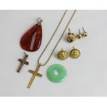 A jade pendant, and amber pendant, two gold cross pendants, a pair of 18ct gold ear studs 6g, and