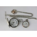 A silver hunter cased pocket watch signed Bracebridges on curb chain and with a lady's German silver