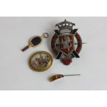 A George III gold and enamel watch key; a gold mounted miniature painted with a scene of a Middle