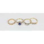 A sapphire ring; two illusion set diamond rings and a full hoop ring