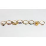 An illusion set 9ct ring and six various gem set rings in 9ct gold A 9ct fluted gold ring