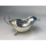 A George V silver sauce boat, maker possibly Hamilton Laidlaw & Co, Sheffield 1933, with scroll