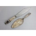 A George Jensen Denmark sterling silver cake slice with cone and scroll terminal 20cm and a