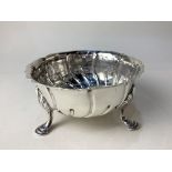 A Victorian silver sweets dish, maker Spink & Son, London 1888, with scalloped border and three hoof