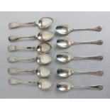 A matched set of six George IV silver fiddle pattern teaspoons engraved foliate terminals with