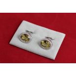 A pair of citrine cufflinks, the oval cuts within a single row of brilliant cuts in 18ct white gold