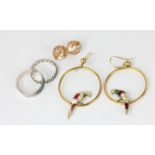 A pair of 9ct gold creole earrings mounted with an enamel parrot; a pair of shell cameo ear studs;
