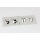 A pair of 18ct white gold cufflinks with central collet set brilliant cut diamond, a pair of 18ct