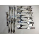 A set of seven Victorian silver dinner forks maker Charles Boyton, London 1844 and three similar