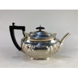 A Victorian silver teapot, makers Atkin Brothers, Sheffield 1899, of half reeded form, 17.8oz gross