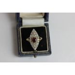 An Edwardian ruby and old cut diamond navette shaped ring