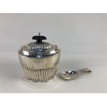 An Edward VII silver tea caddy, makers Barker Brothers, Chester 1909, of half reeded form,