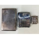 A George V silver cigarette case, maker E J Trevitt & Sons, Birmingham 1914, monogrammed, together