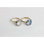 A cubic zirconia dress ring in 9ct yellow gold, a blue paste ring in 9ct gold
