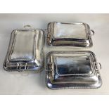 A pair of silver plated rectangular tureens and covers, with gadroon borders, together with