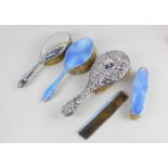 A George V silver and blue guilloche enamel backed three piece dressing table set, maker W G Sothers