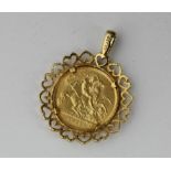 A 1911 half sovereign in a 9ct gold pendant mount